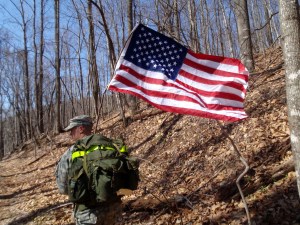 Soldier carrying American Flag at Terrapin Mtn 50k